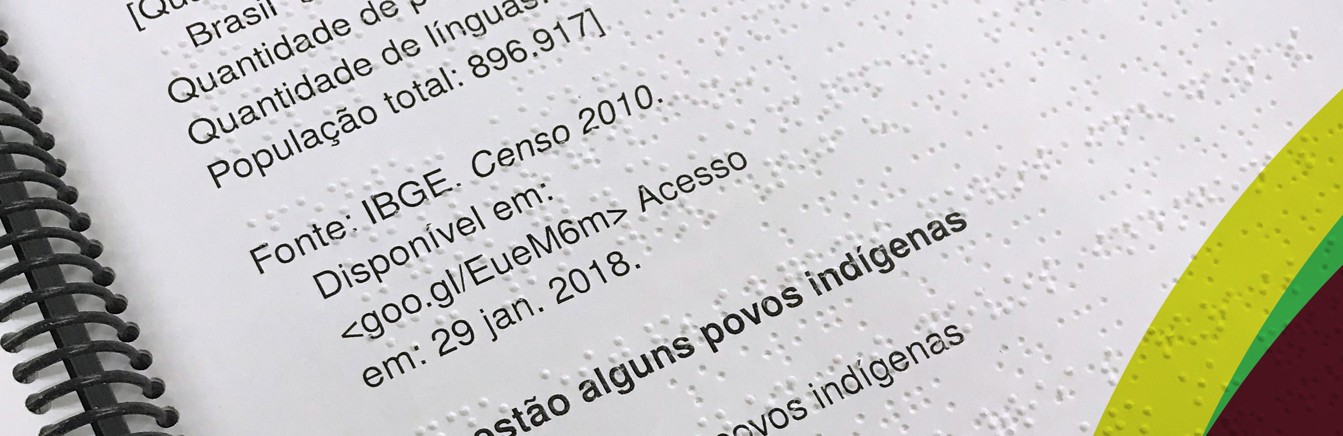 Foto mostrando uma página ampliada em braille.